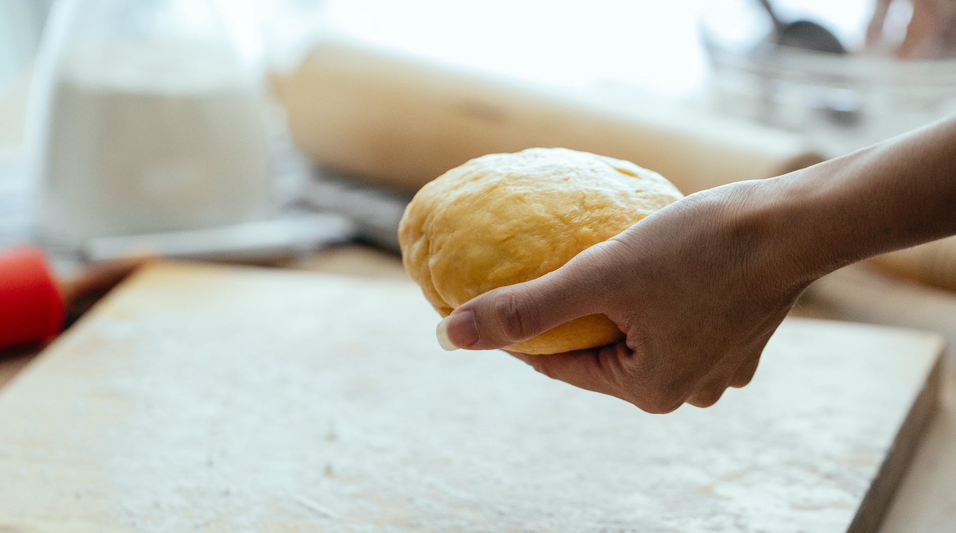 female hand with row dough